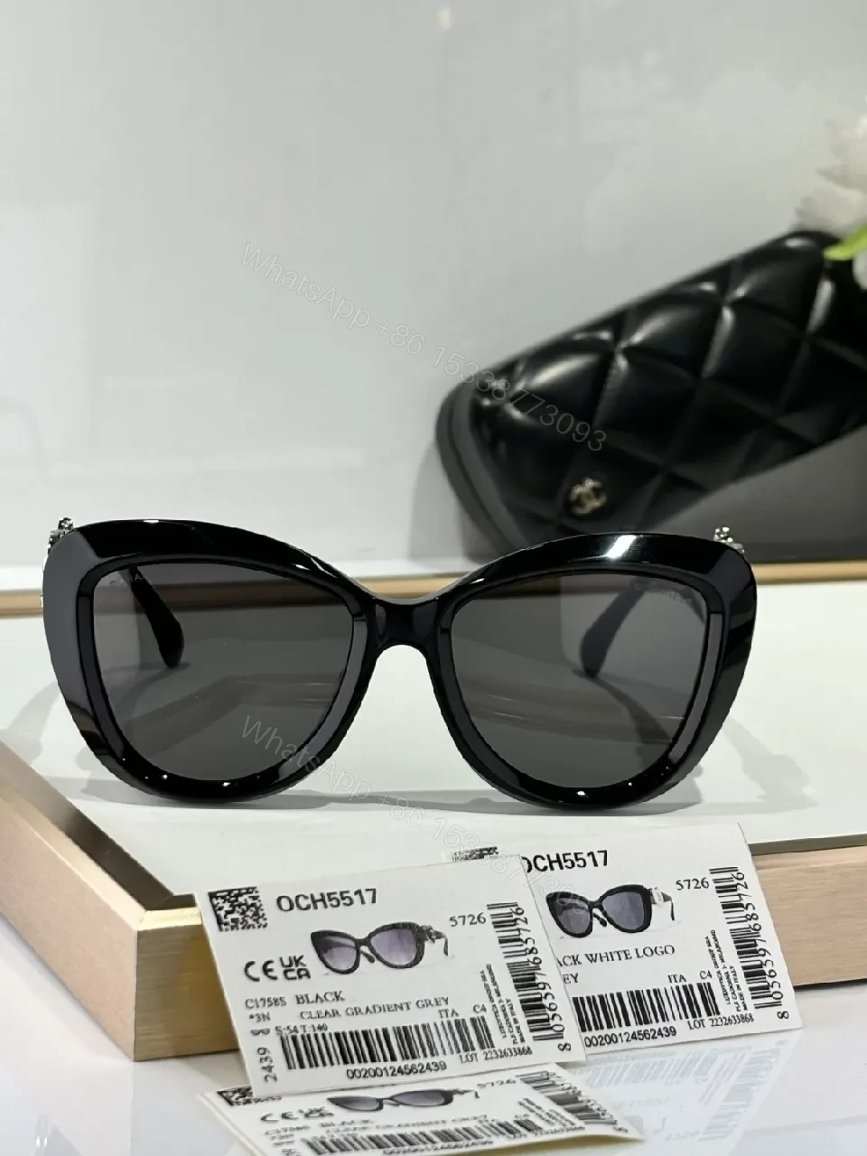View 8 of Oversized Black Cat-Eye Sunglasses with Subtle Logo Details