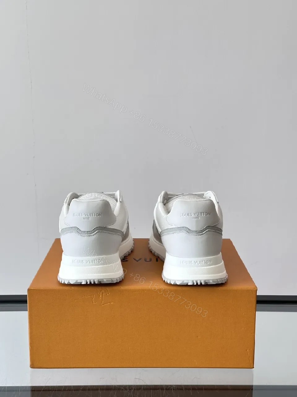 View 7 of Minimalistic White Leather Sneakers with Subtle Texture and Monogram Accent