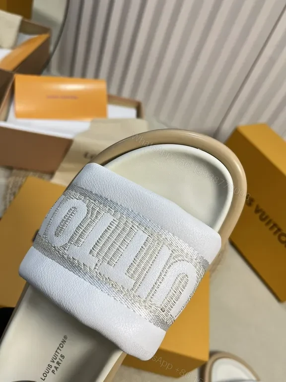 View 2 of Louis Vuitton Luxe Textured Slides with Logo Embellishment