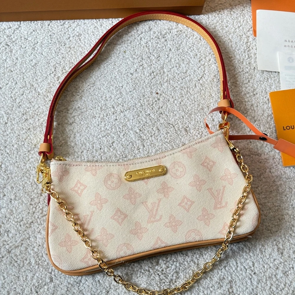 View 2 of Louis Vuitton Pochette Liv Monogram Origine Lin 24Cm