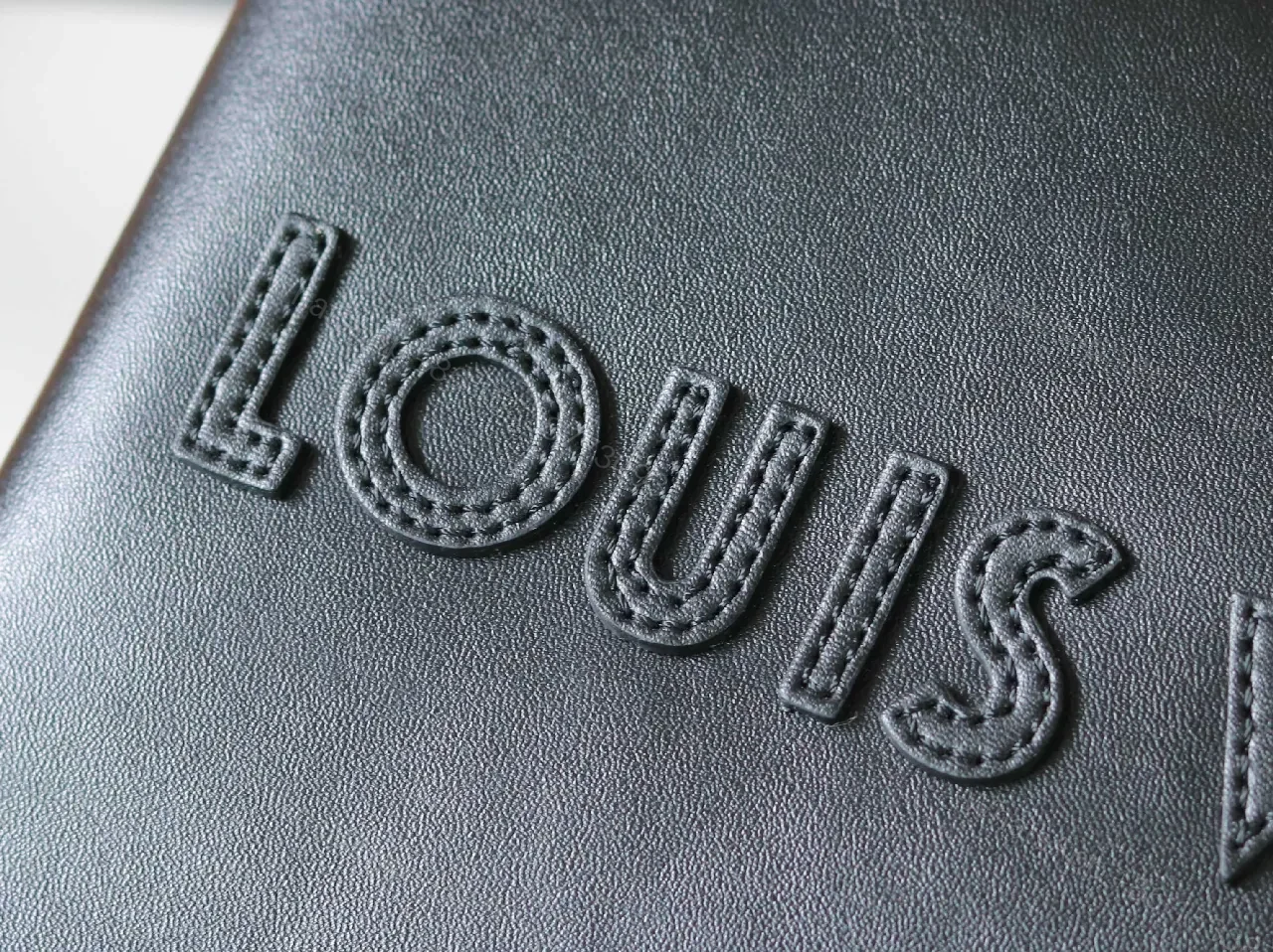 View 5 of Structured Minimalist Clutch: Luxe Faux Leather, Embossed Logo, Magnetic Closure