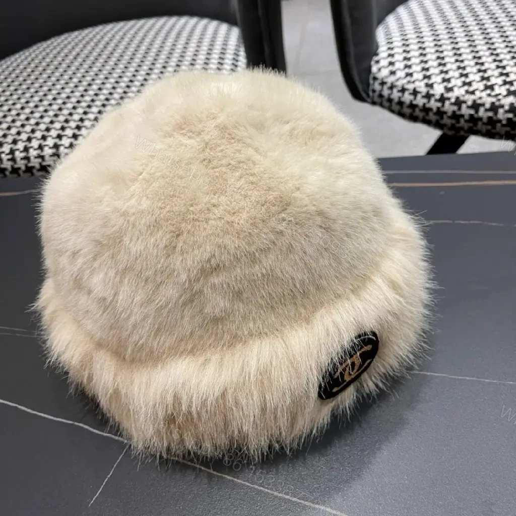 View 9 of Cream Faux Fur Pom Hat: Lux Soft Warmth, Subtle Logo Accent