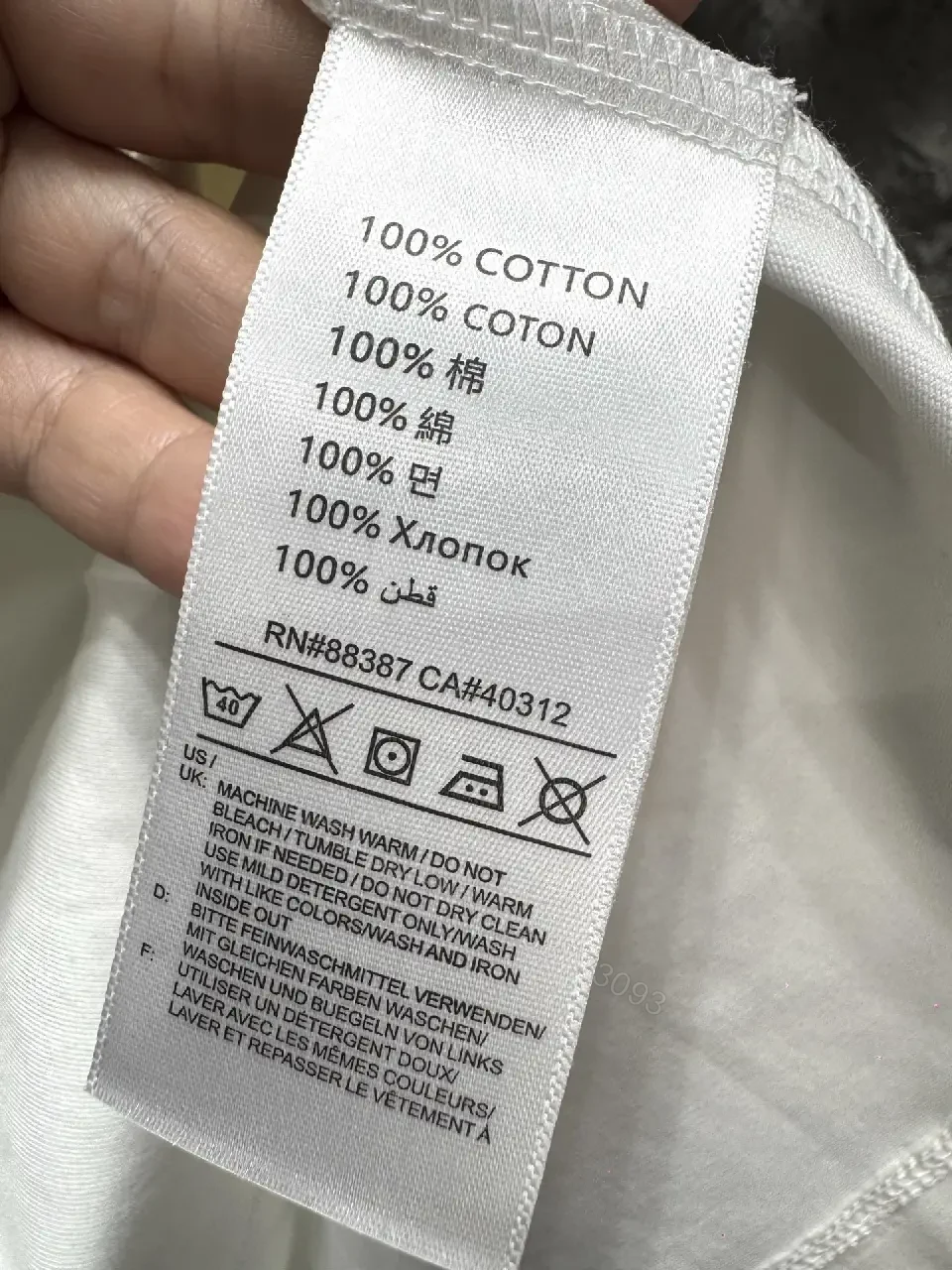 View 7 of White Cotton Crewneck Tee - Subtle Designer Crest, Everyday Luxury