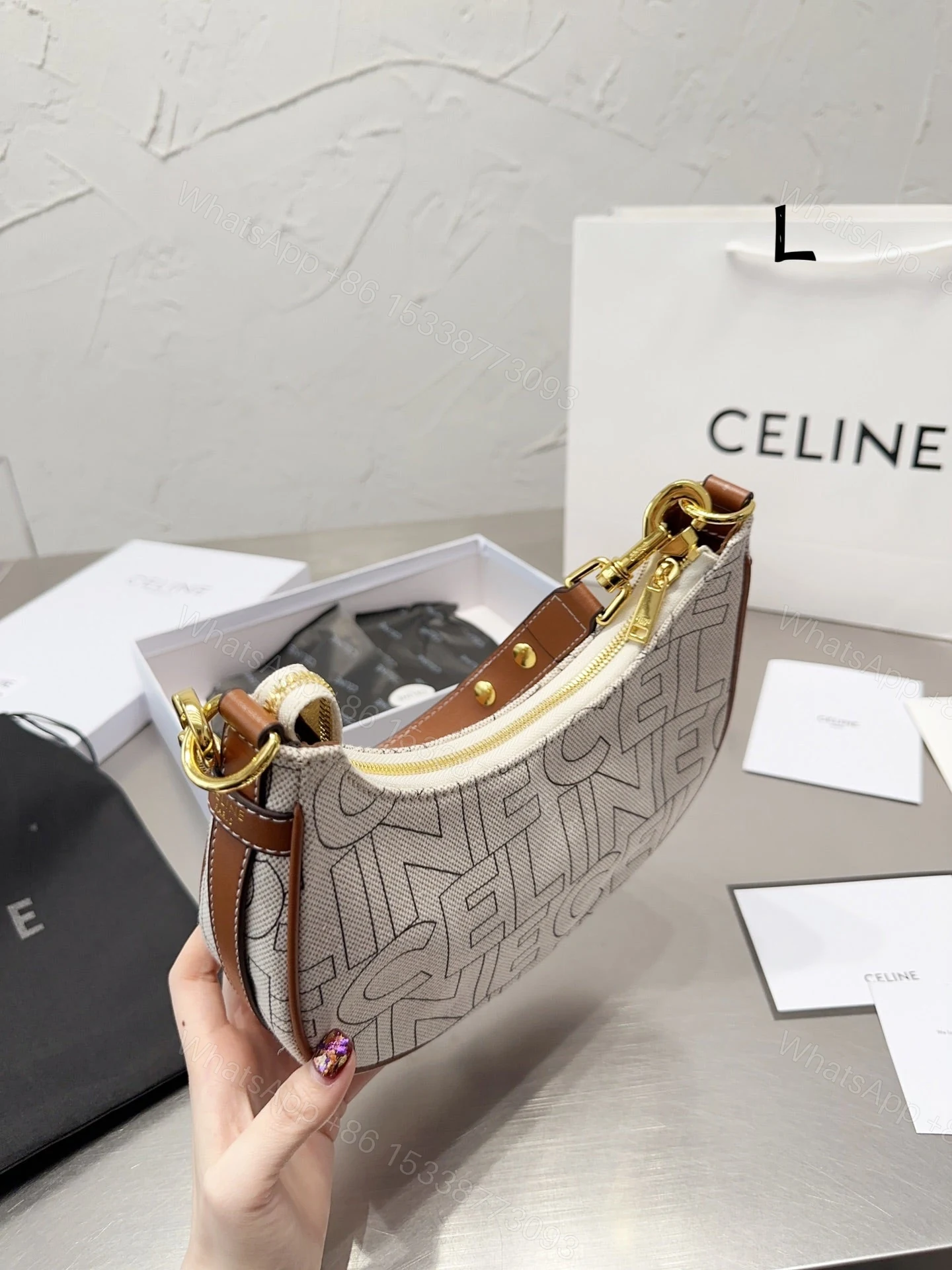 View 3 of CELINE MEDIUM AVA STRAP BAG IN TEXTILE WITH ALL OVER PRINT NATURAL 25CM 196922ERK02NT