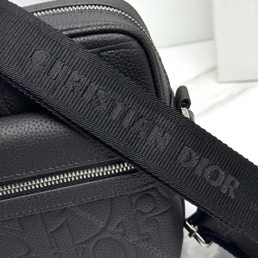 View 8 of Compact Leather Crossbody Bag - Embossed Texture, Luxury Minimalism