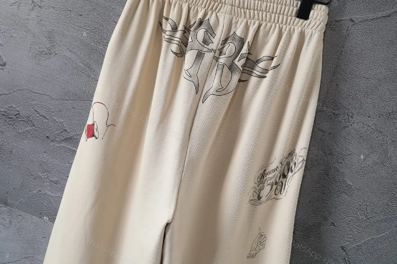 View 8 of Beige Wide-Leg Pants with Drawstring and Embroidered Patches