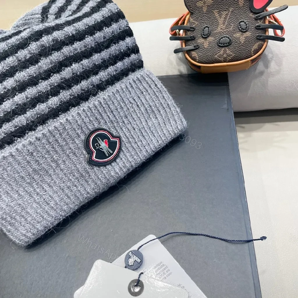 View 2 of Cozy Striped Knit Beanie with Moncler Badge - Luxe Warmth