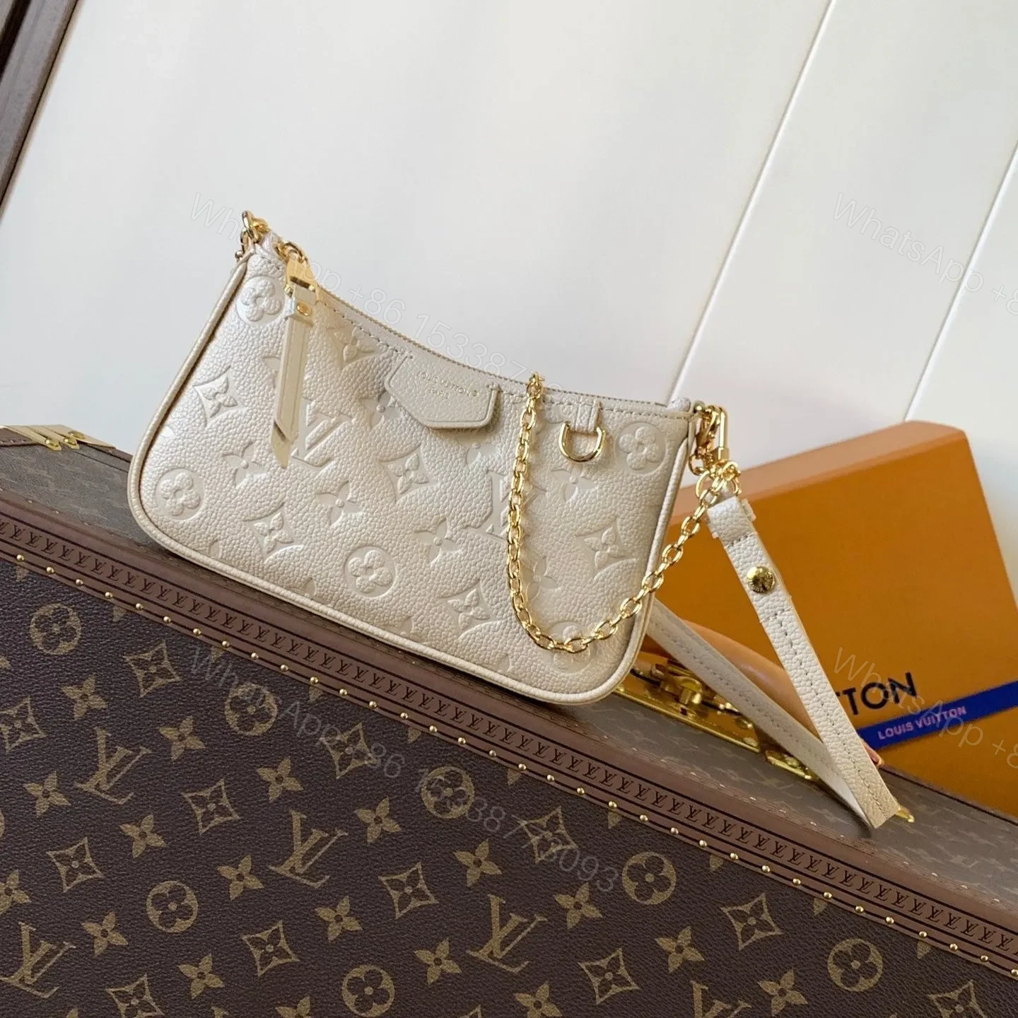 LV EASY POUCH ON STRAP 19 IN BEIGE MONOGRAM EMPREINTE LEATHER — view 1