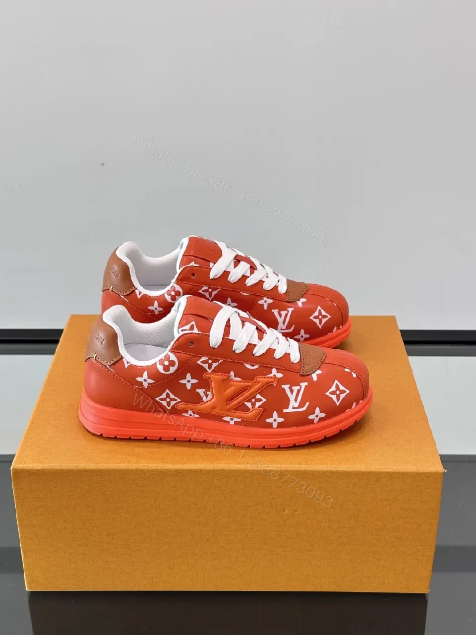 Bold Orange-Red Monogram Sneaker: Luxe Designer-Inspired High-Tops — view 1