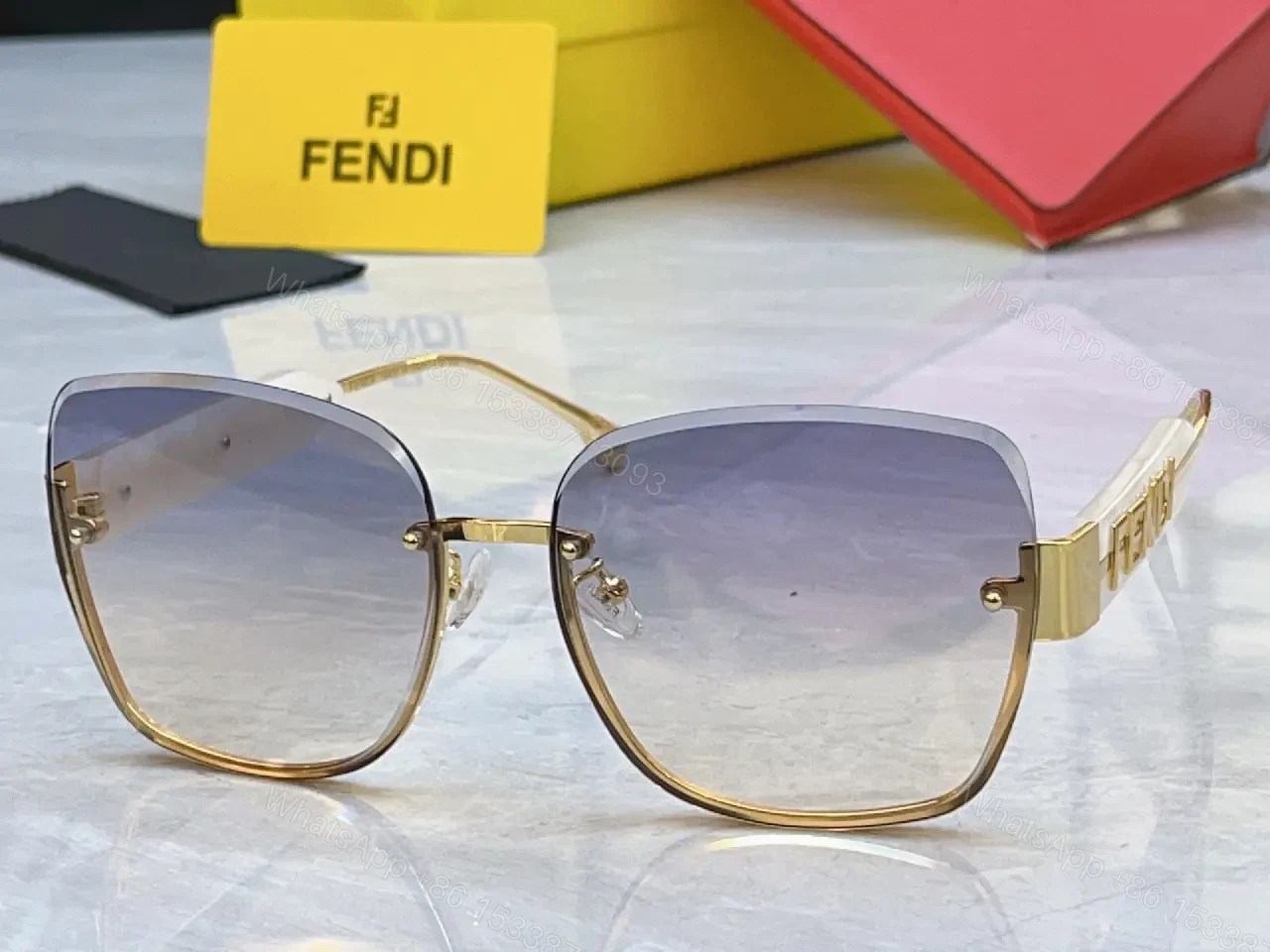 View 9 of Gold Frame Pink Gradient Sunglasses with FENDI Logo