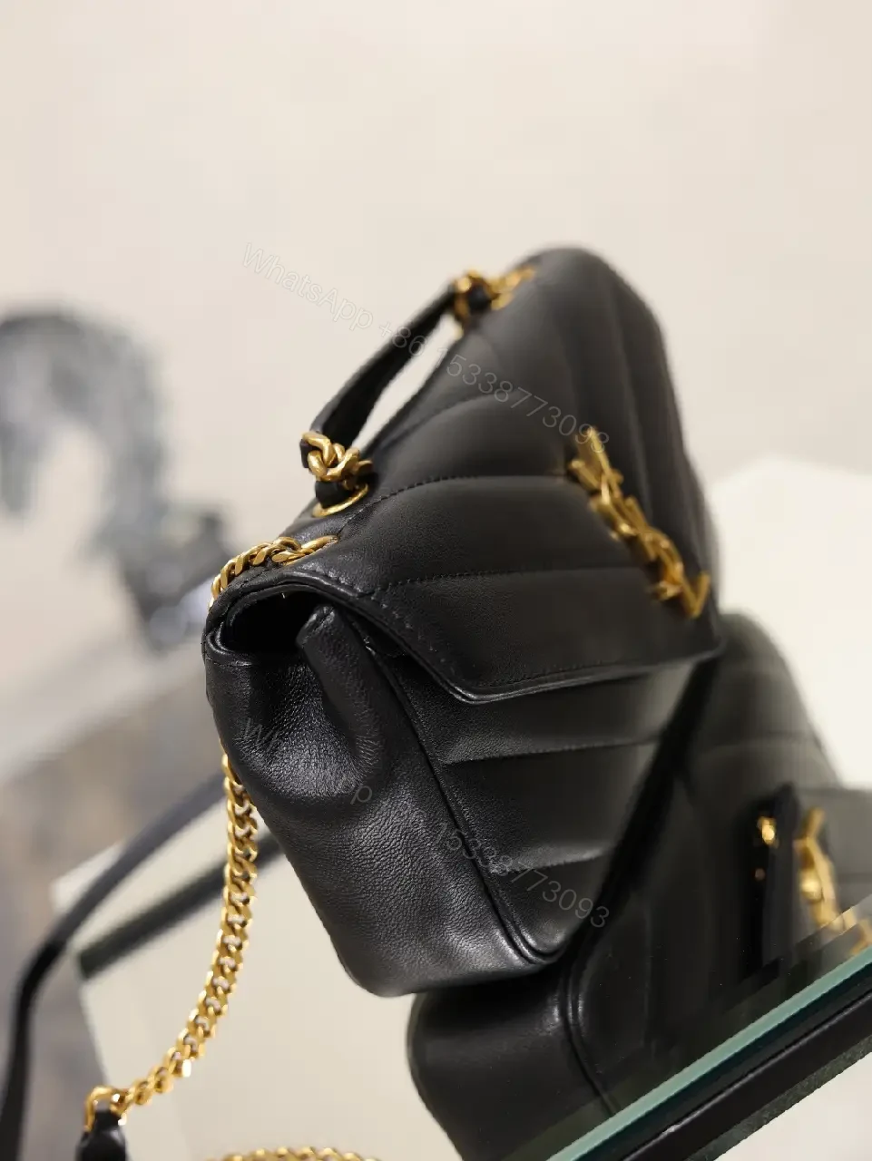 View 5 of Black Leather Structured Shoulder Bag Envelope Flap with YSL Logo Product Type