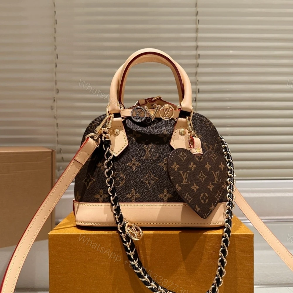 View 2 of Louis Vuitton Alma Mini LV And I Monogram Brown 25Cm K00016