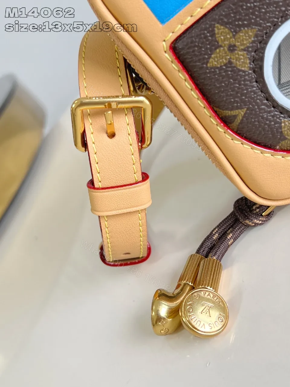 View 2 of Compact Luxury Crossbody: Monogram Canvas with Blue Accent and Gold Hardware