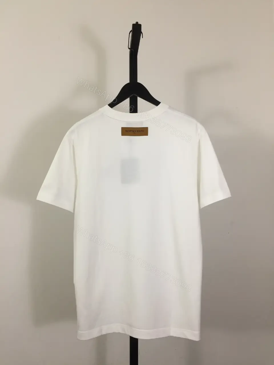 View 4 of Minimalist White Tee: Subtle LV-Inspired Emblem, Premium Cotton Blend