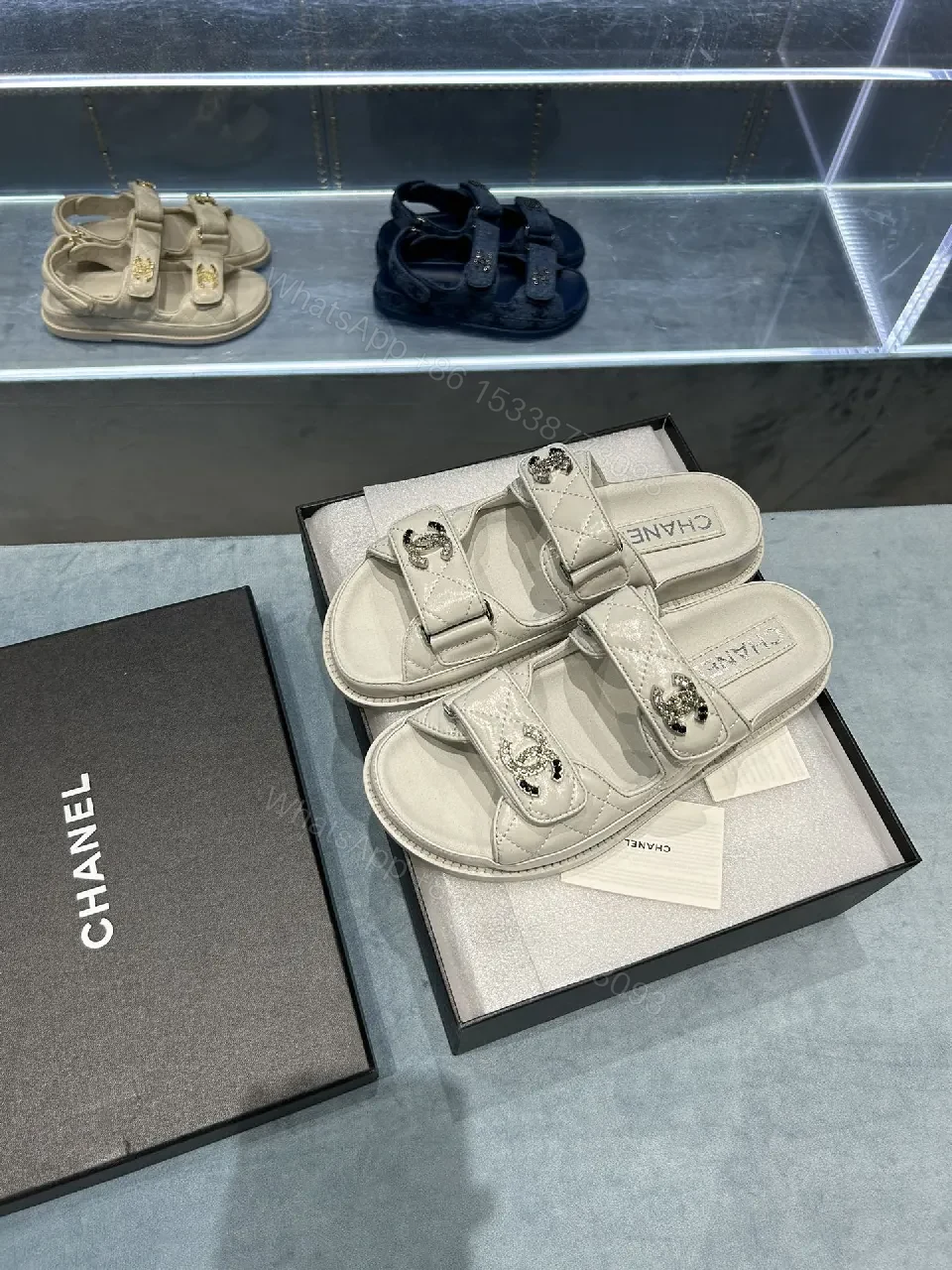 View 2 of Chic White Sandals with Quilted Straps and Logo Hardware