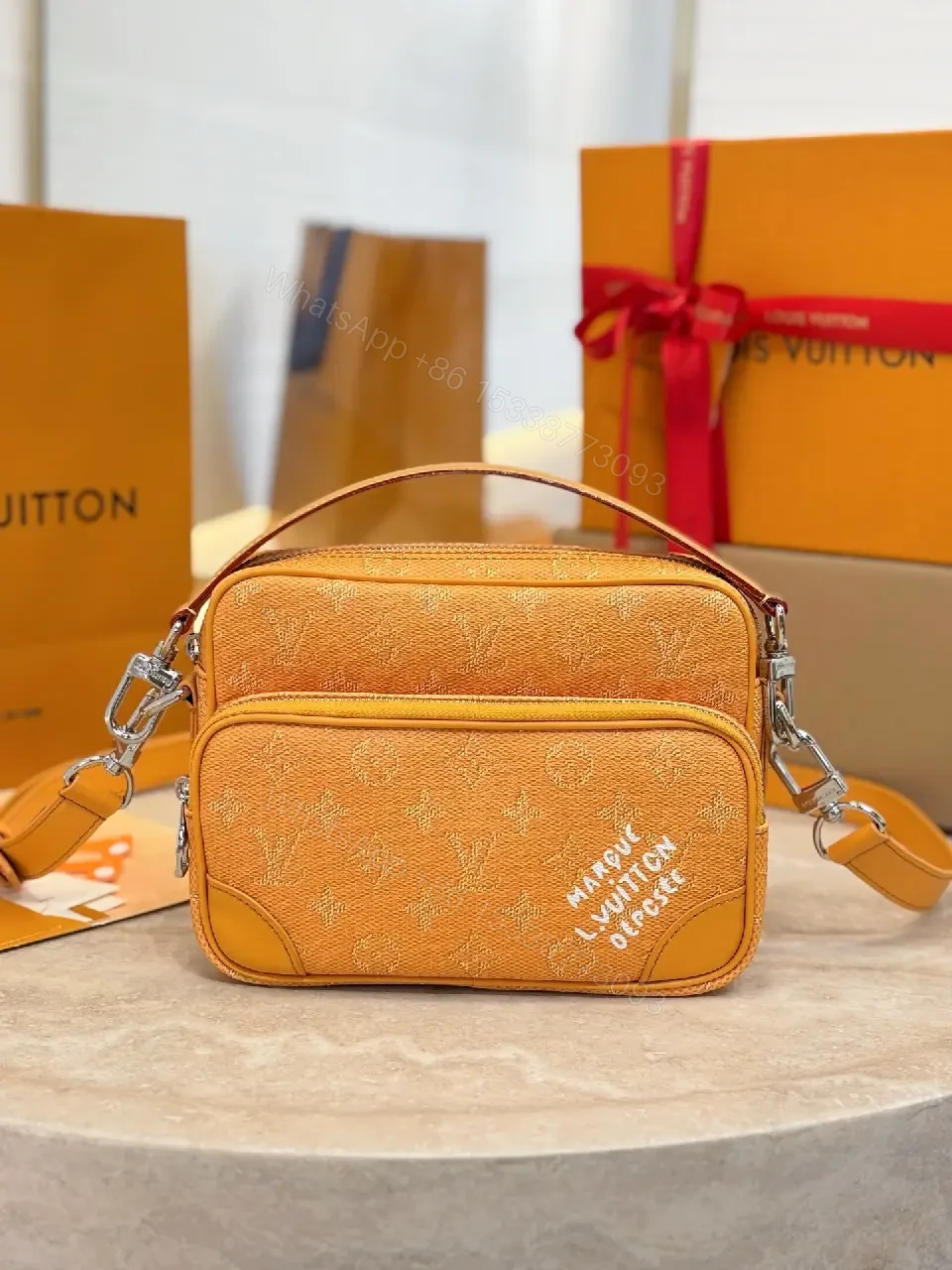 Caramel Canvas Crossbody: Textured Monogram, Compact Chic — view 1
