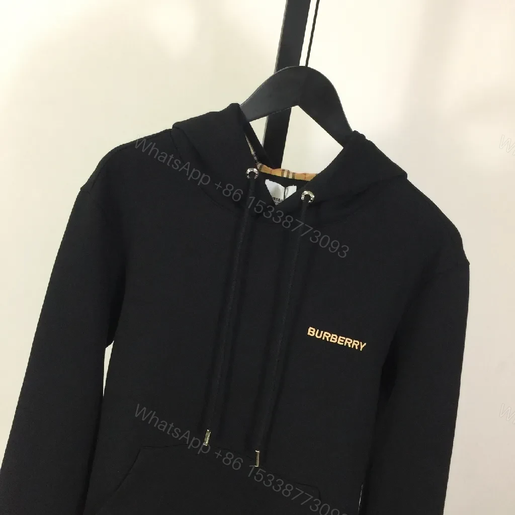View 4 of Minimalist Black Hoodie with Gold Logo – Premium Casual Wear