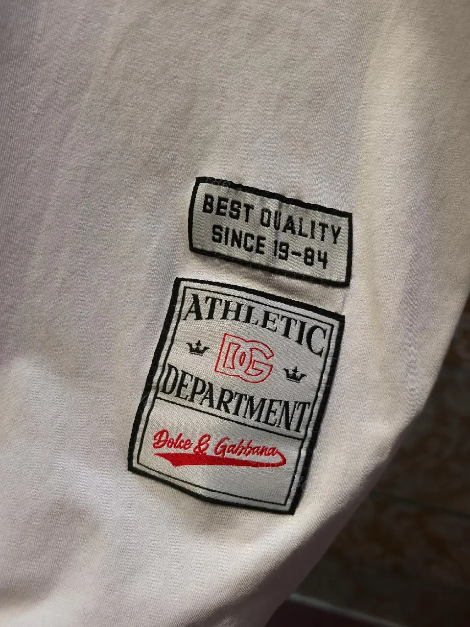 View 8 of Minimalist White Cotton Tee with Subtle Front Logo and Patches