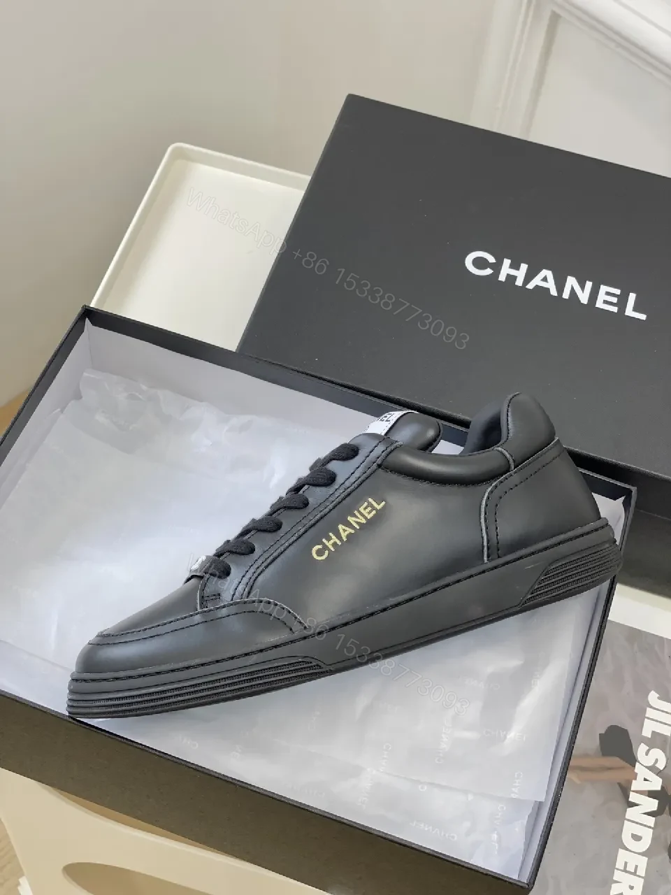 View 8 of Black Leather Sneakers, Subtle Gold Accents, High-Top Style, Everyday Luxury