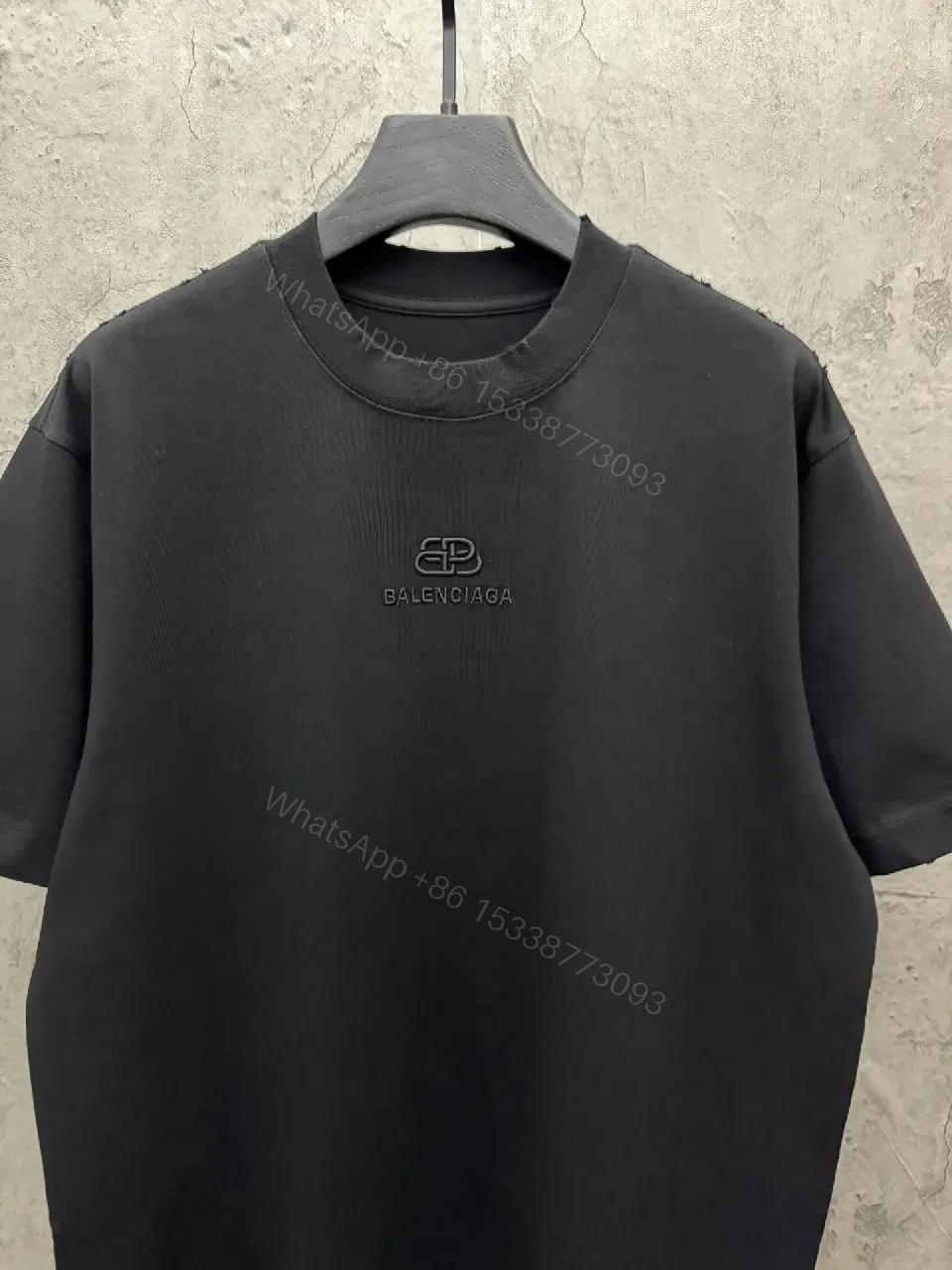 View 2 of Textured Logo Black Knit Tee – Oversized Luxury Streetwear