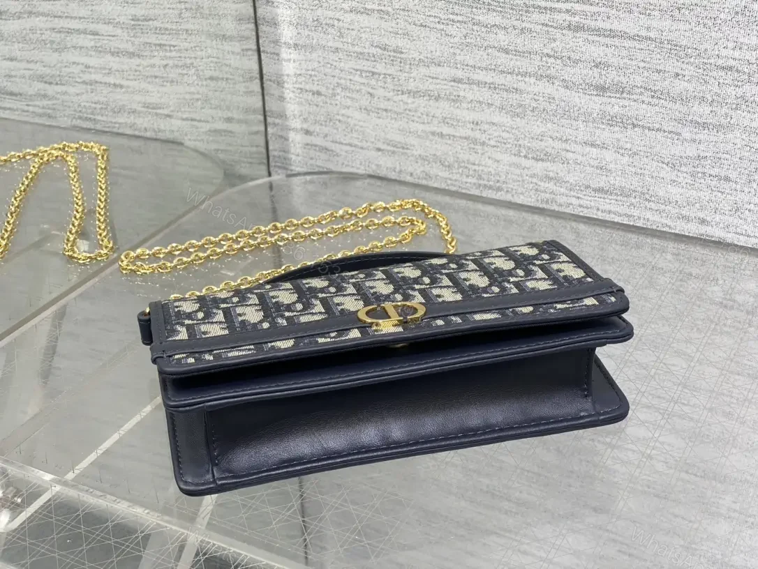 View 10 of Navy monogram canvas leather-trim shoulder bag for everyday luxury