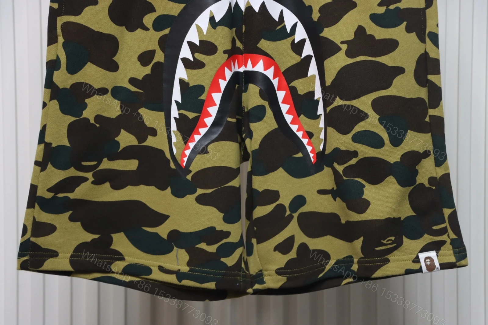 View 3 of BAPE Camouflage Shark Mouth Shorts Green
