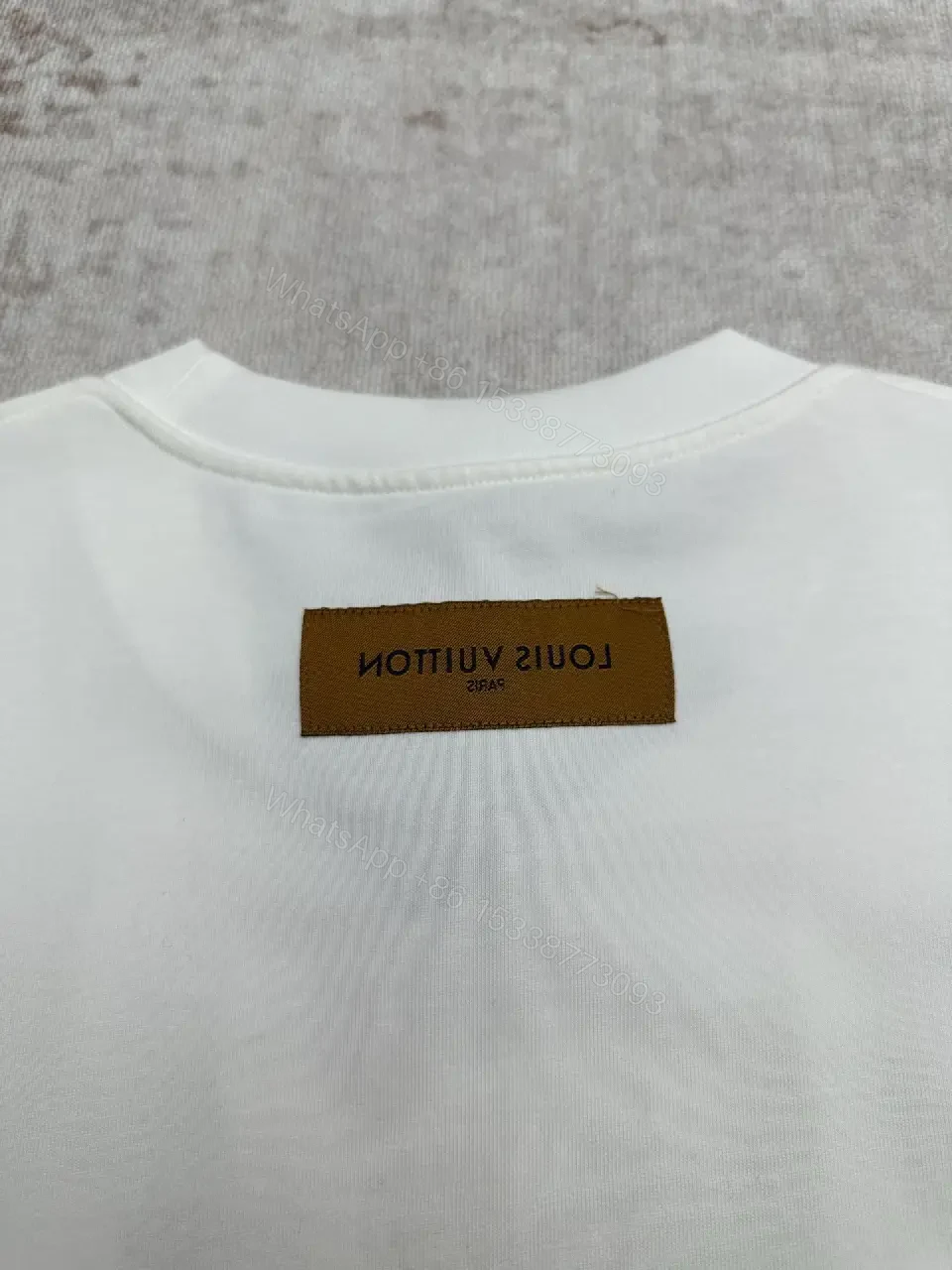 View 4 of Minimalist White Cotton Tee with Embossed Accent, Everyday Luxury