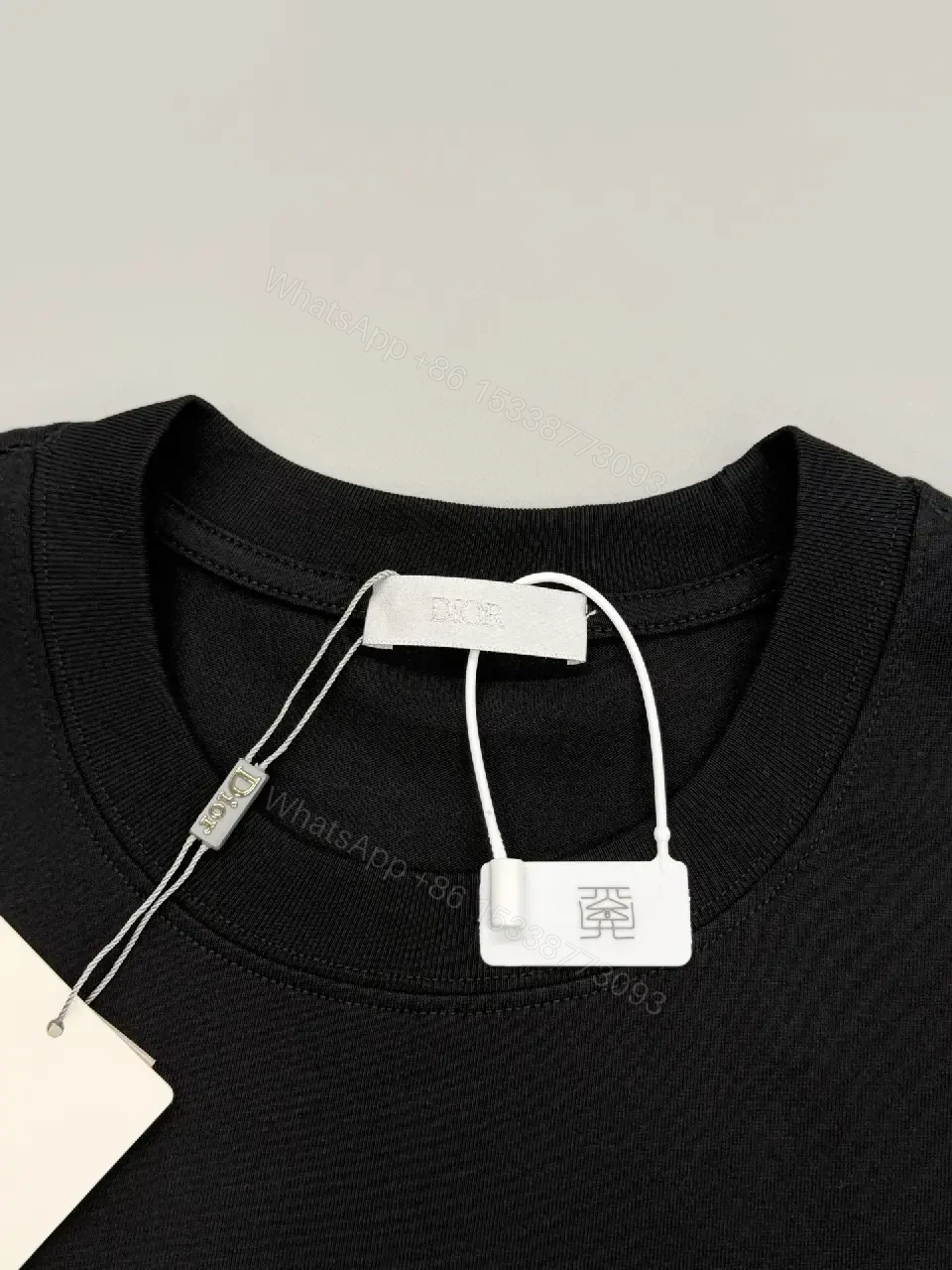 View 9 of Bold Black Cotton Tee: Subtle Luxe Dior Graphic