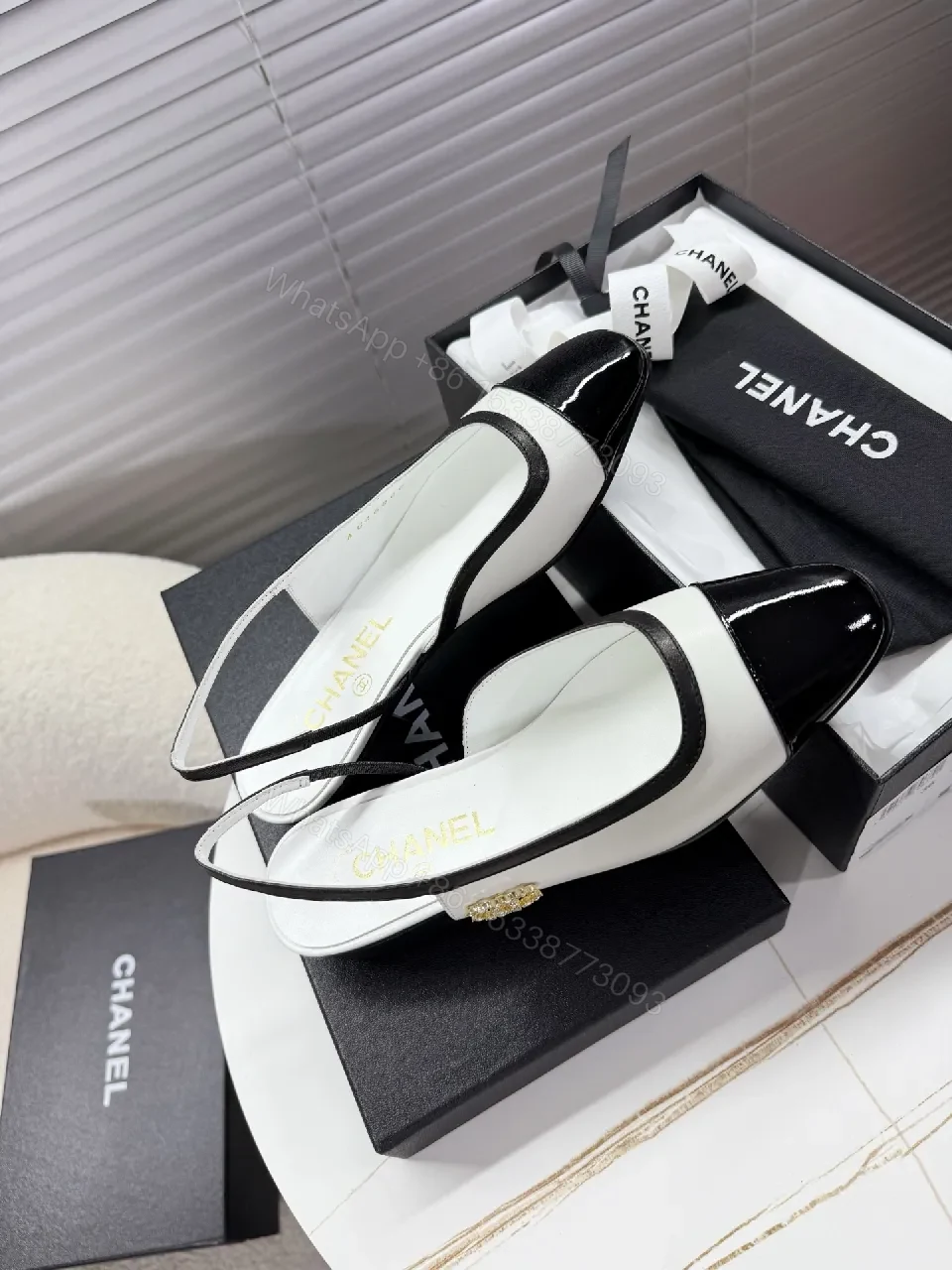 View 5 of Two-Tone Patent Slingback Pumps: Sharp Architectural Elegance