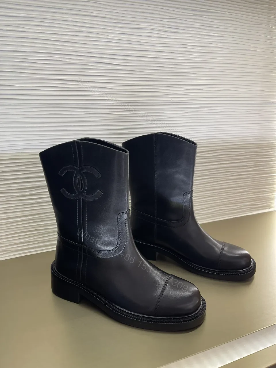 View 5 of Chic Black Leather Knee-High Boots with Logo Embellishment