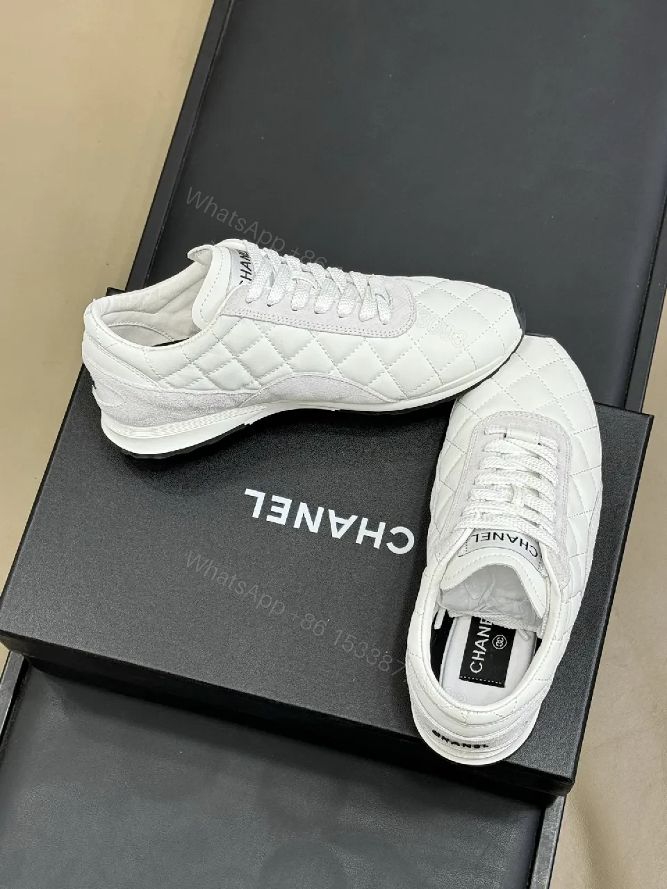 View 4 of White Quilted Leather Low-Top Sneakers with Signature Detailing