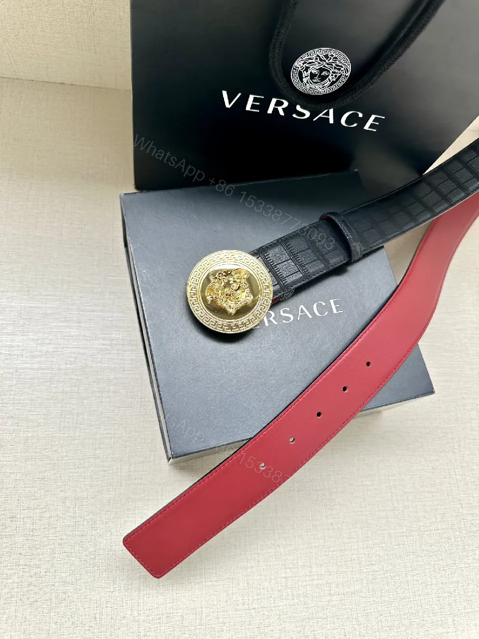 View 7 of Textured Leather Belt with Medusa Buckle - Crocodile-Embossed, Black/Burgundy, Luxury Belt
