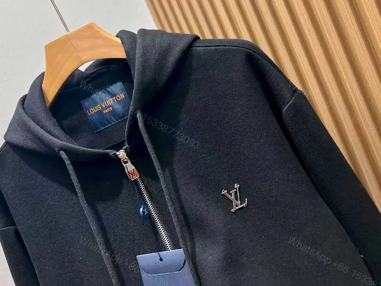 View 4 of Cozy Black Knit Zip Hoodie with Subtle Emblem Embellishment