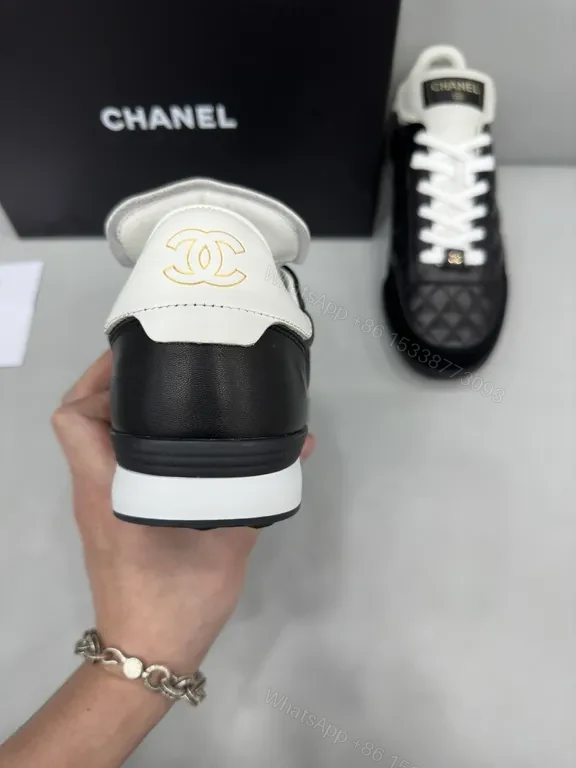 View 4 of Chanel-Quilted Leather High-Top Sneakers with Signature Details