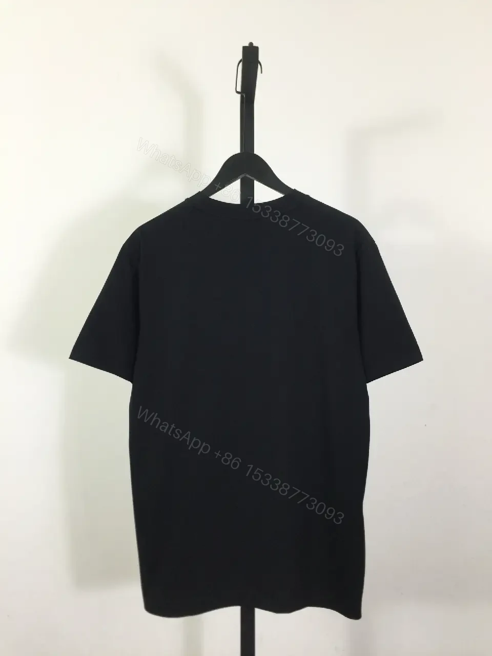 View 5 of Minimalist Black Logo Tee: Premium Cotton Blend, Relaxed Fit