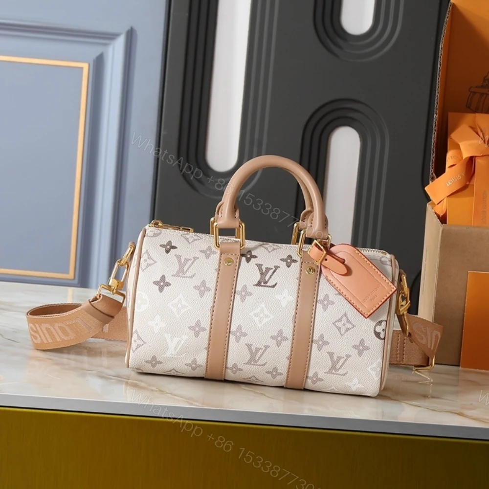 View 2 of Louis Vuitton Keepall Bandoulière 25 Monogram Beige 25Cm