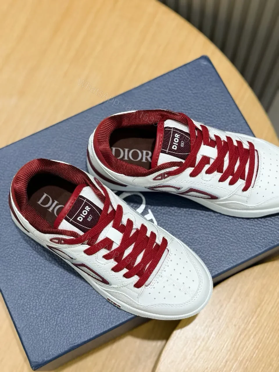 View 3 of White Leather Burgundy Accented Low-Top Sneakers: Modern Luxury Style