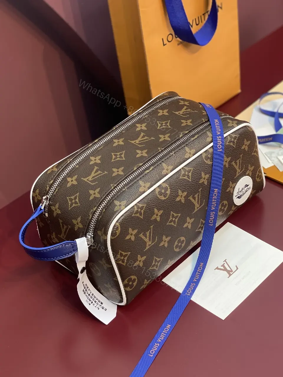 View 8 of Blue Leather Trim Toiletry Bag: Monogram Canvas, LV Zippers, Adjustable Strap