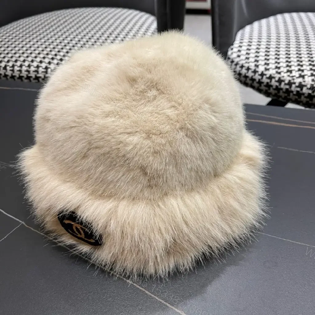 View 7 of Cream Faux Fur Pom Hat: Lux Soft Warmth, Subtle Logo Accent