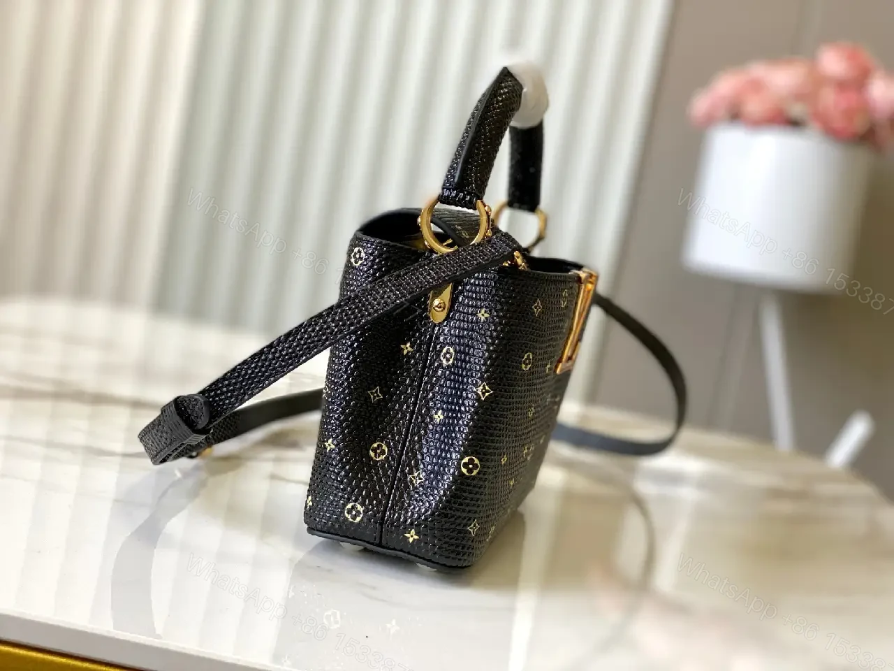 View 7 of Compact Black Pebble-Grain Top-Handle Bag with Gold Hardware