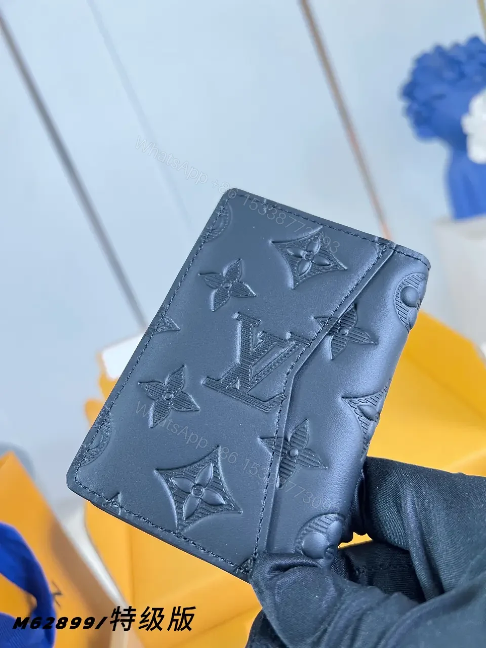 View 3 of Black Leather Slim Bi-Fold Wallet with Embossed LV Pattern