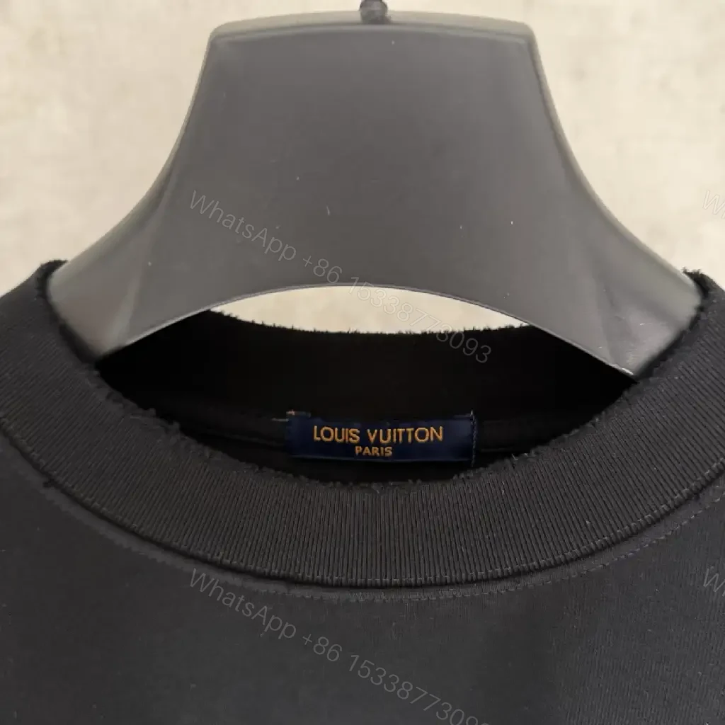 View 3 of Oversized Black Knit Tee, Luxury Crest Embroidery, Casual Comfort