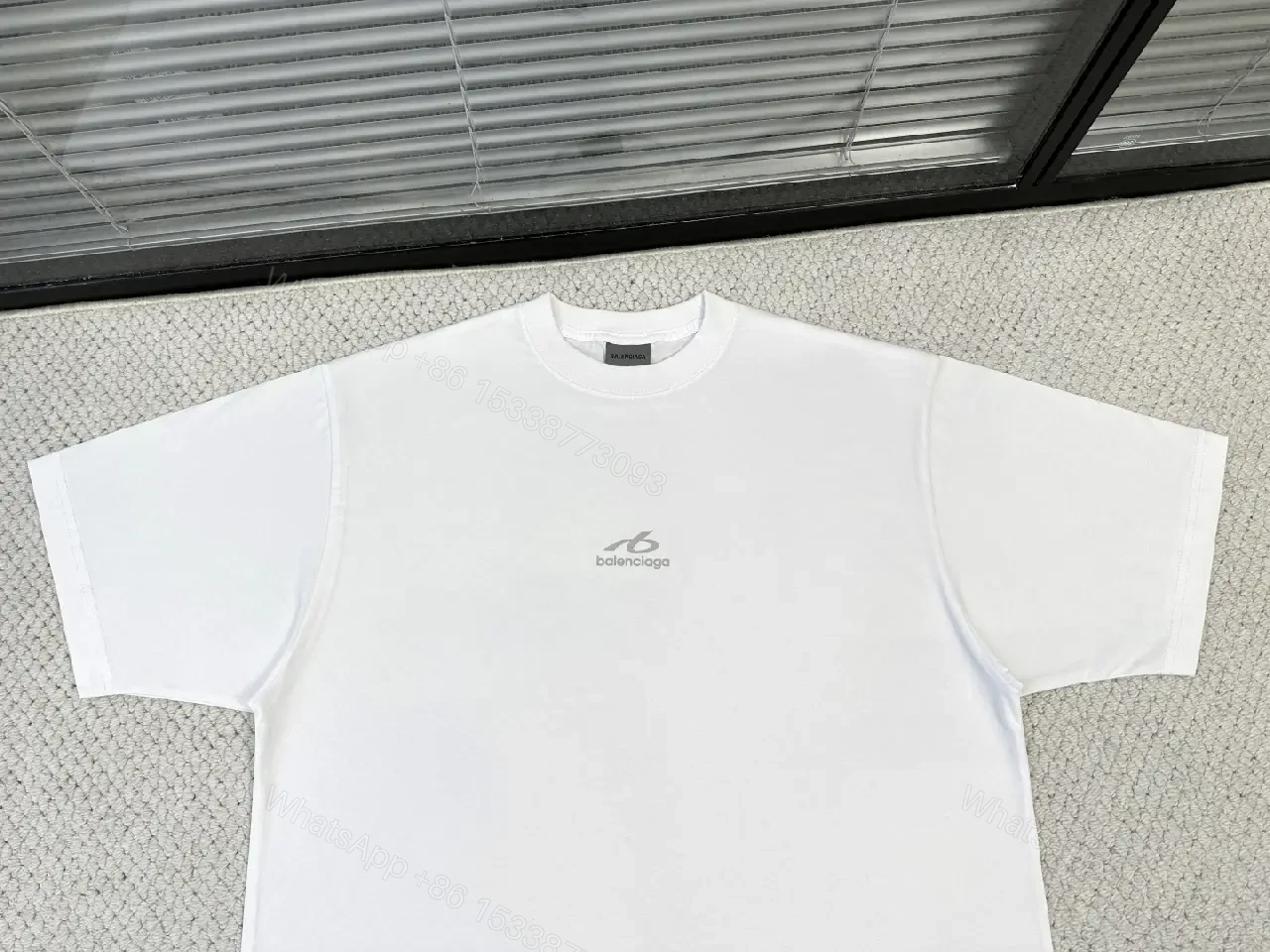 View 2 of White Cotton Minimalist T-Shirt with Balenciaga Logo