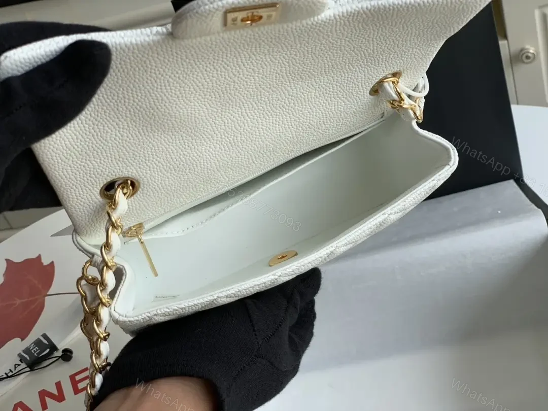 View 8 of Quilted White Flap Bag with Gold Hardware—Compact Elegance