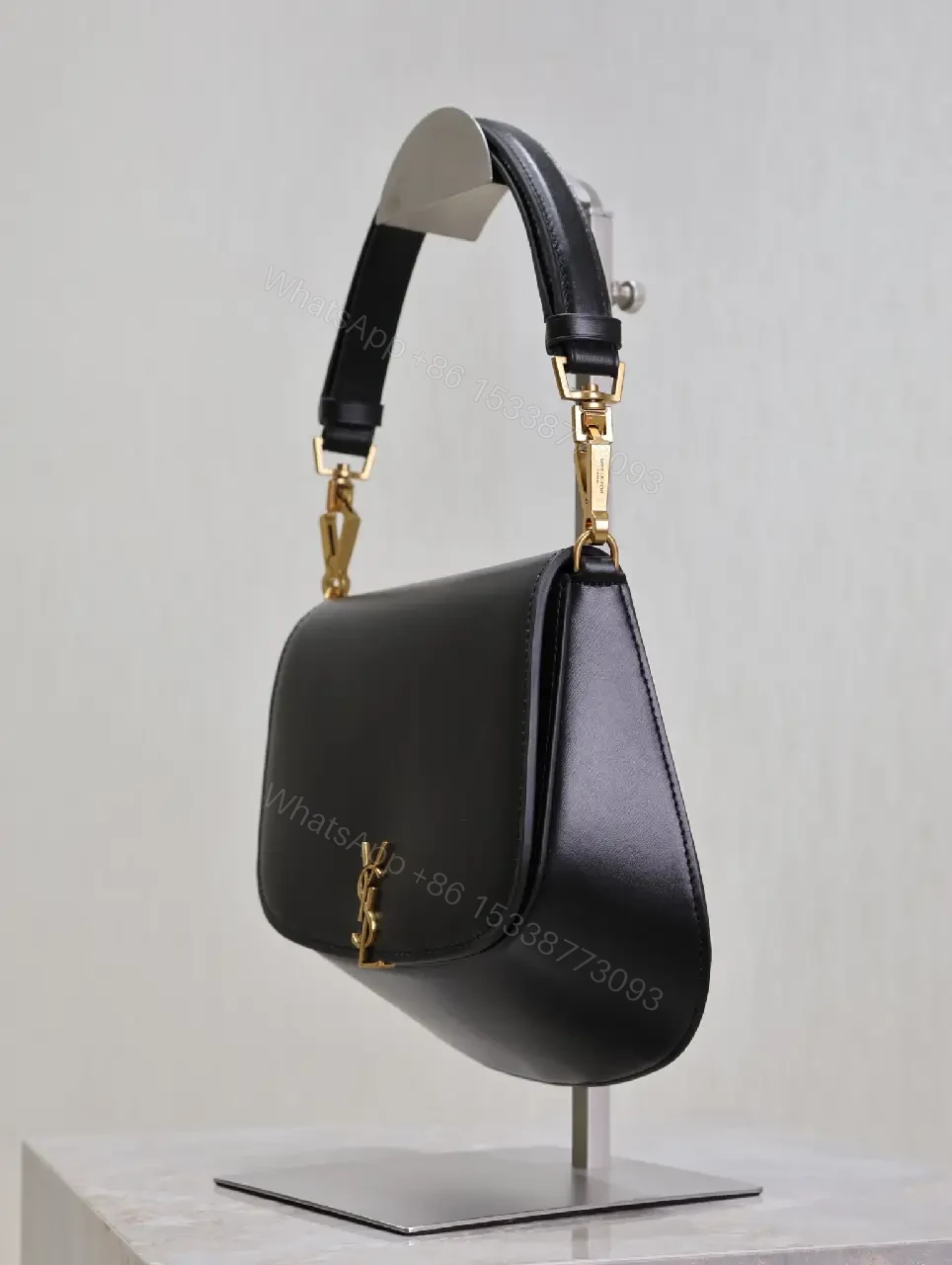 View 2 of Structured Leather Crossbody with Gold Emblem, Compact & Versatile Bag