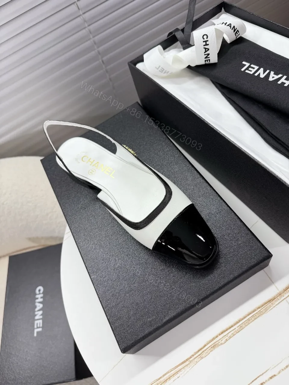 View 3 of Two-Tone Patent Slingback Pumps: Sharp Architectural Elegance