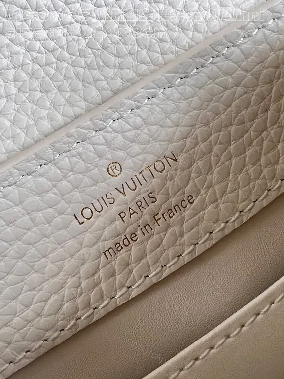 View 7 of Pristine White Pebbled Mini Bag with LV Hardware