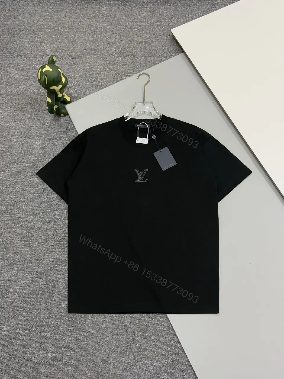 View 4 of Premium Black Tee — Discreet Logo, Soft Cotton Blend, Structured Fit