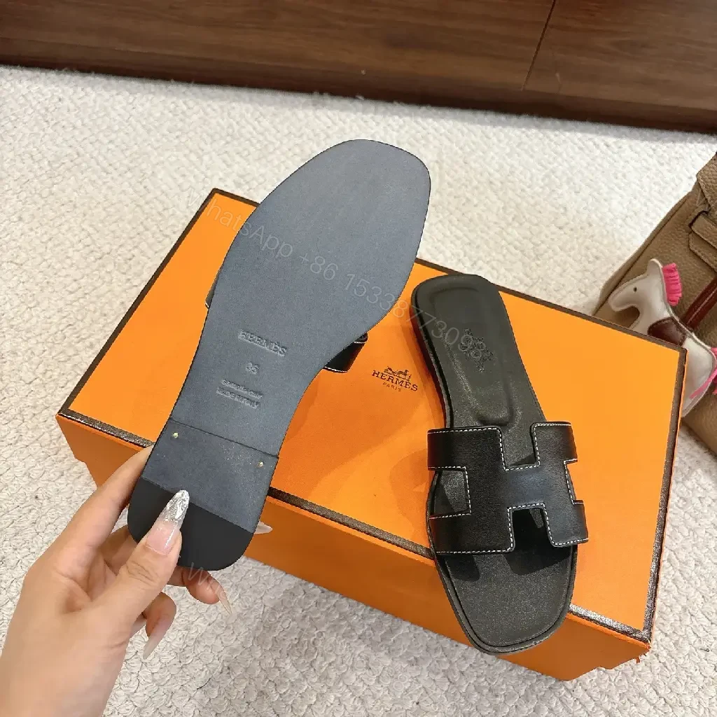 View 10 of black leather slide sandals with H-shaped buckles for luxury everyday