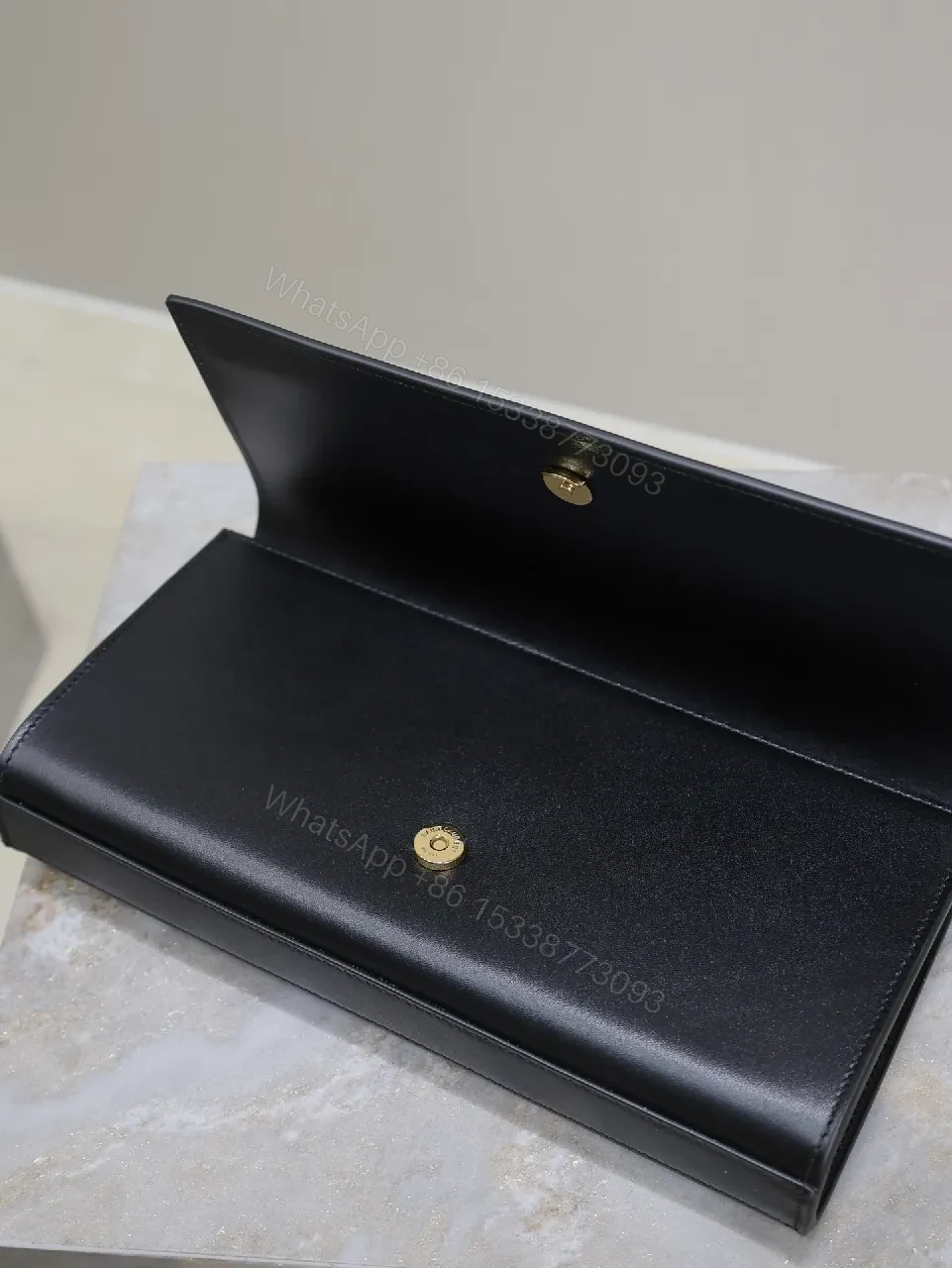 View 5 of Elegant Leather Clutch: Black, Gold Hardware, Minimalist Luxe